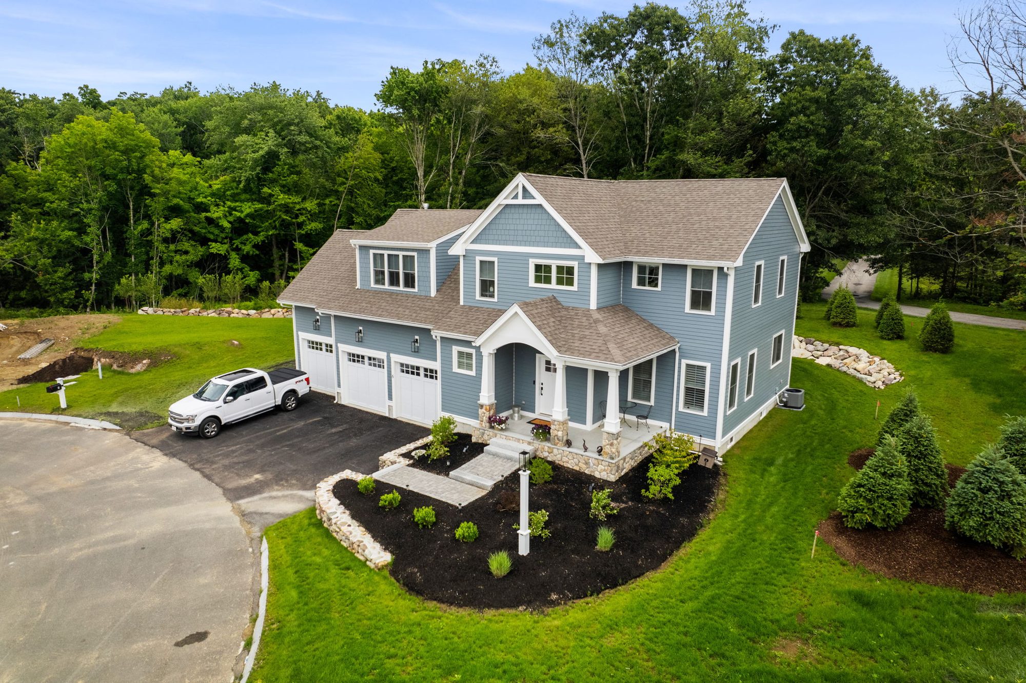 A Fieldstone Village home with navy siding