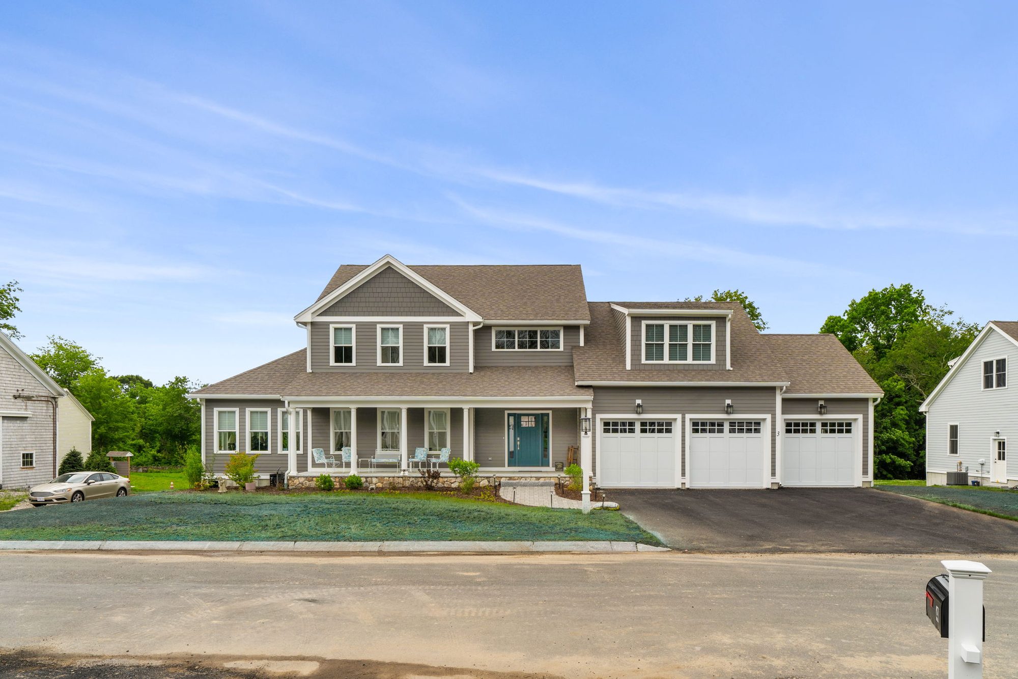 A Fieldstone Village home with charcoal siding