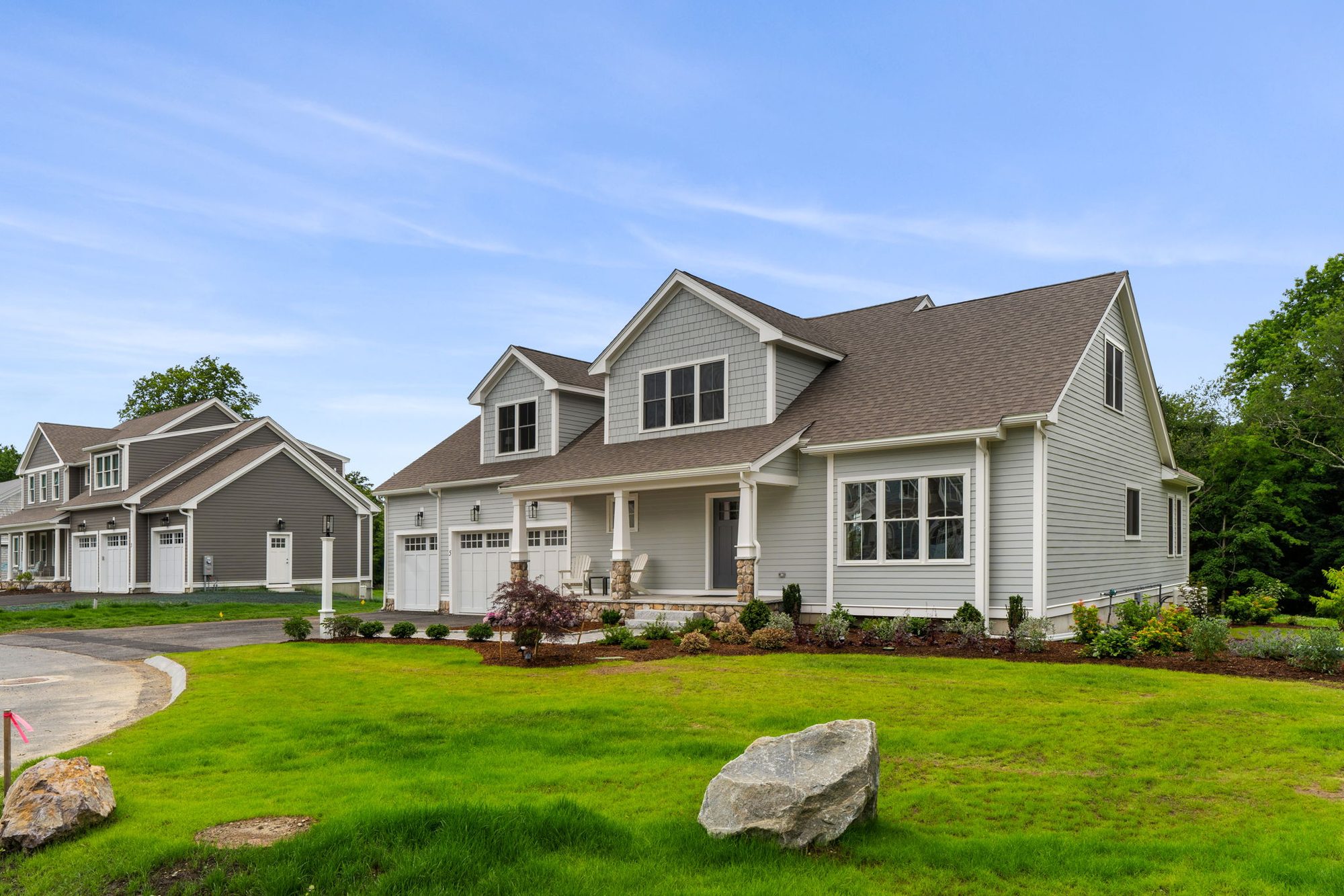 A Fieldstone Village home with sage exterior